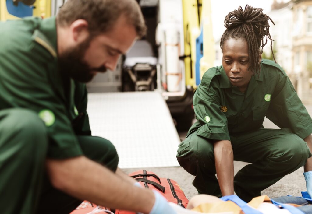 Paramedics performing CPR during training, illustrating CPR teaching challenges and instructor burnout.